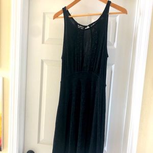 Free People black flowy dress with lace back.